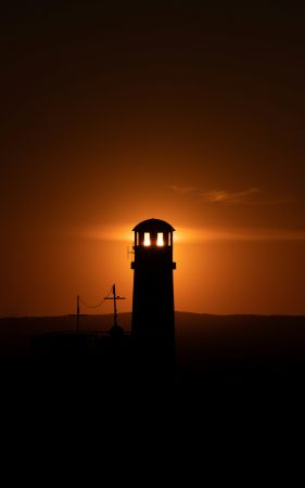 Radiant Lighthouse Sunset